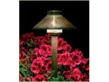 FX Luminaire path light in a bed of annual geranium